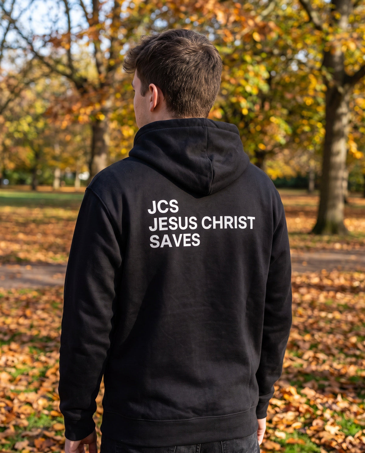 Back of a black JCS — Jesus Christ Saves Christian hoodie showing the large back print