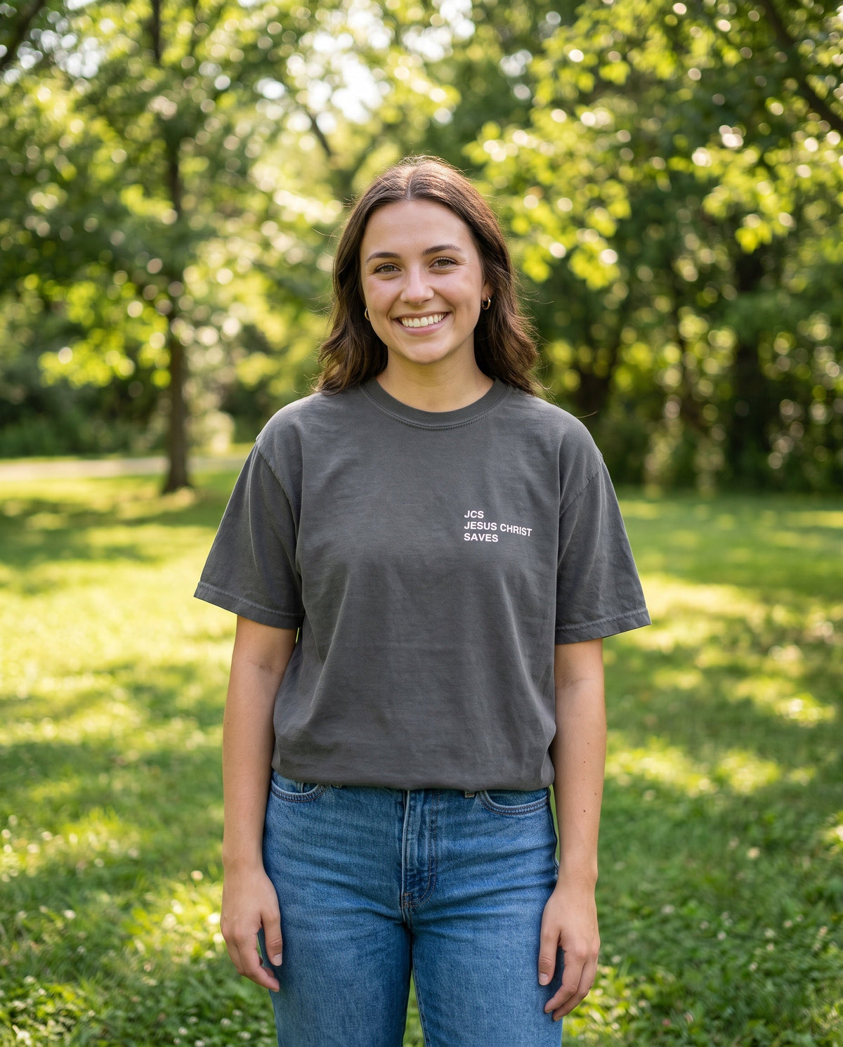 Woman wearing a pepper JCS — Jesus Christ Saves Christian t-shirt, chest print