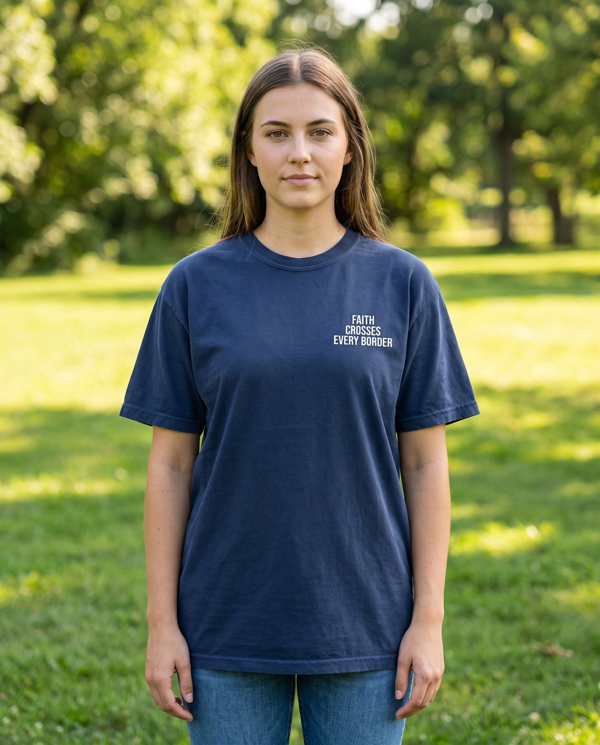 Woman wearing a truenavy Faith Crosses Every Border Christian t-shirt, chest print