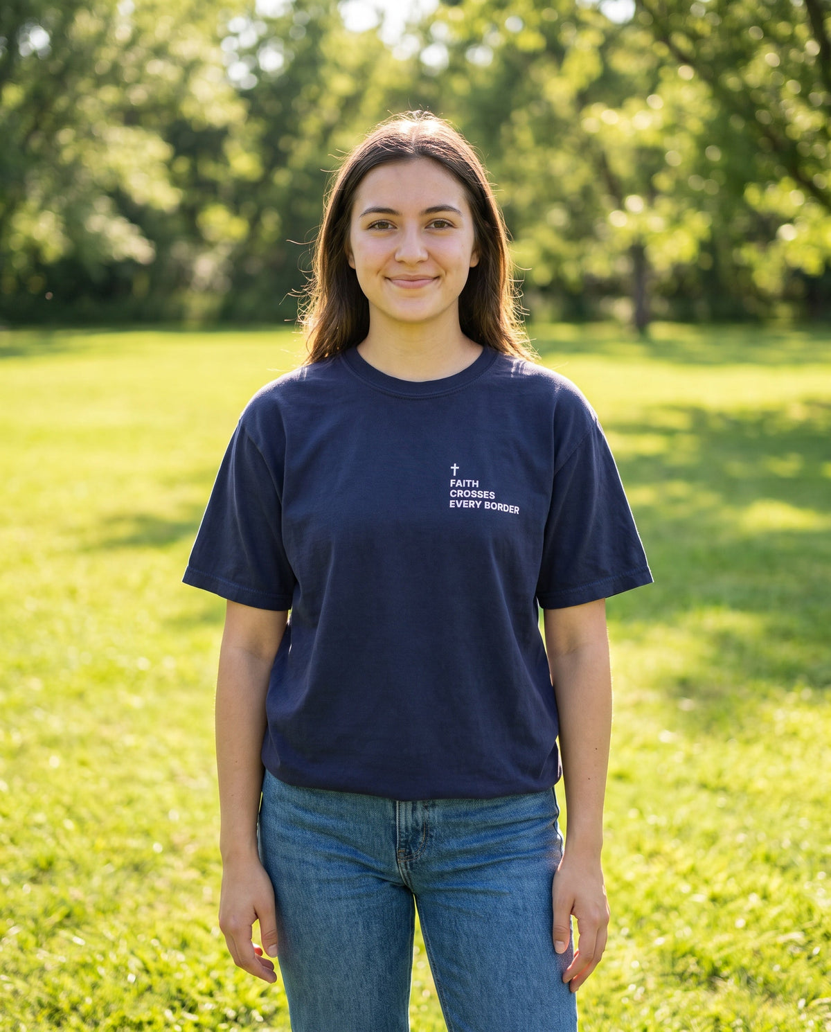 Woman wearing a truenavy Faith Crosses Every Border Cross Edition Christian t-shirt with cross chest print