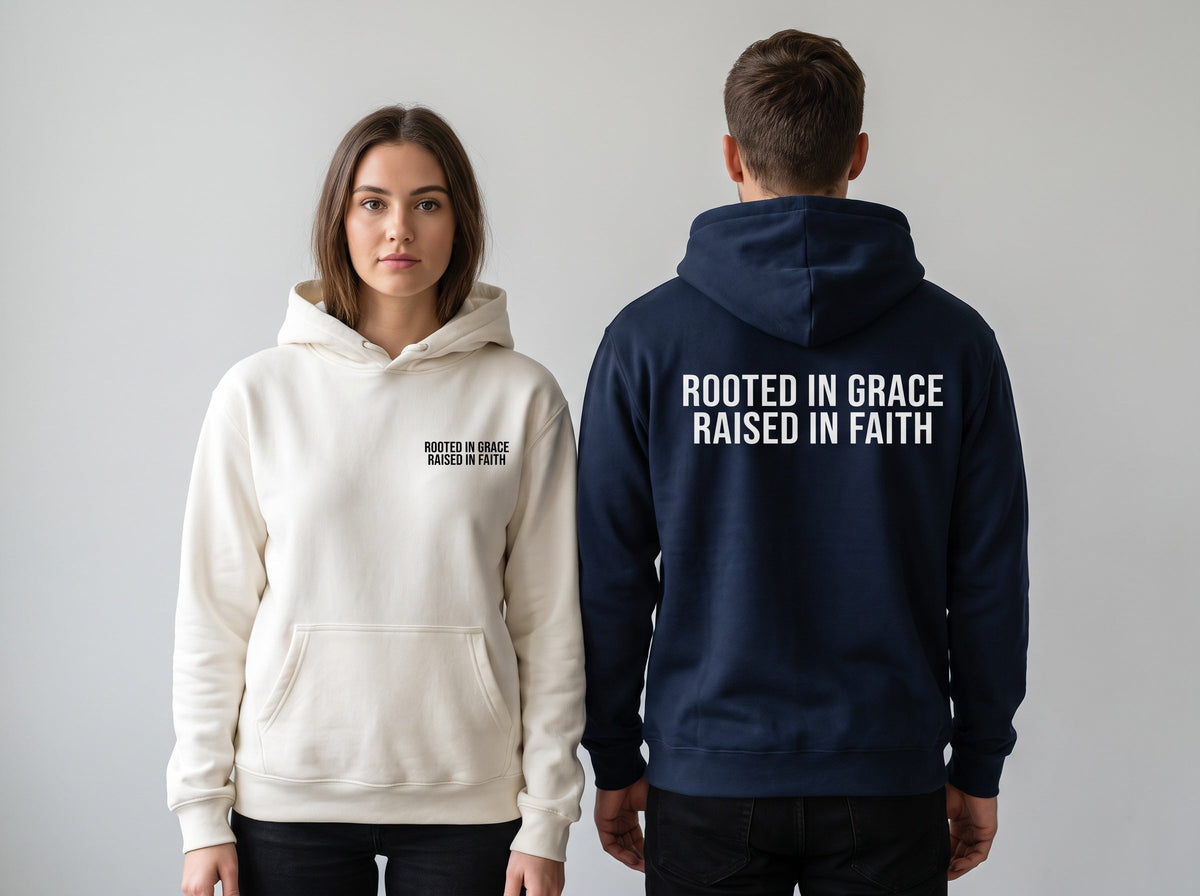 Couple wearing Rooted in Grace. Raised in Faith Christian hoodies, front chest print and large back print