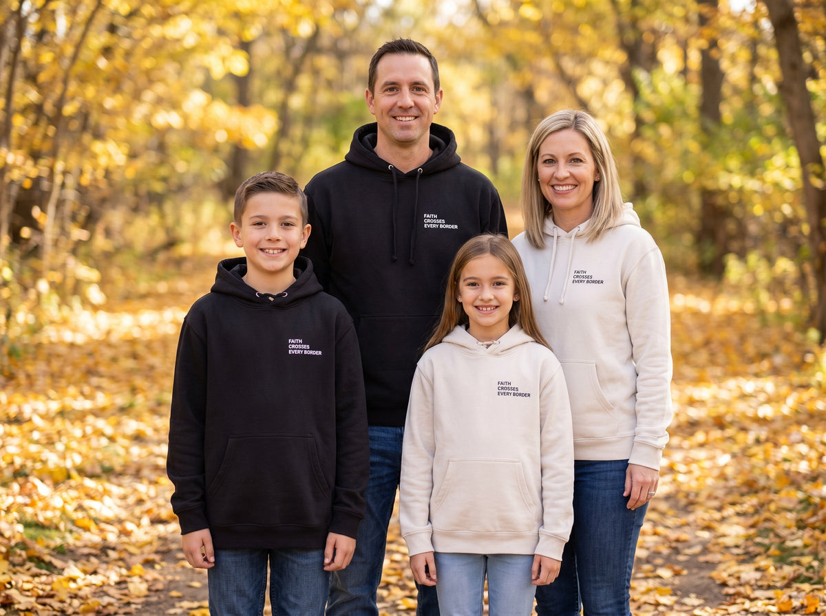 Family wearing matching Faith Crosses Every Border Christian hoodies