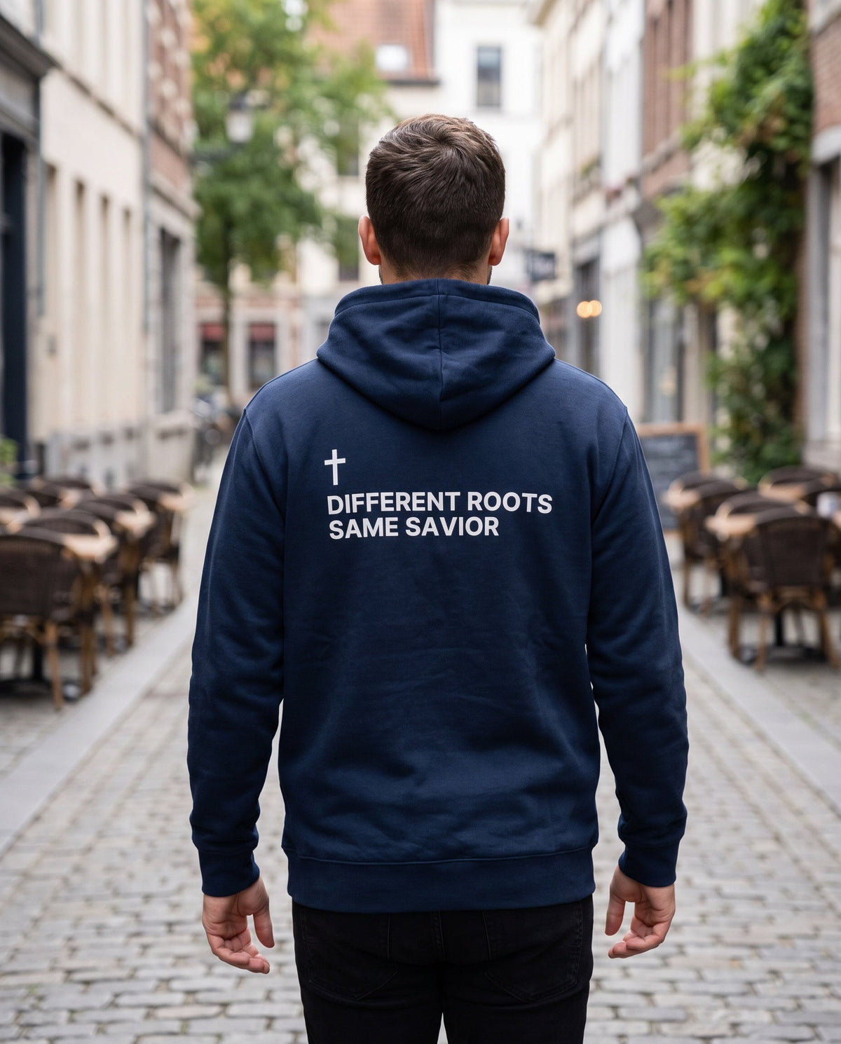 Back of a navy Different Roots. Same Savior Cross Edition Christian hoodie showing the large back print