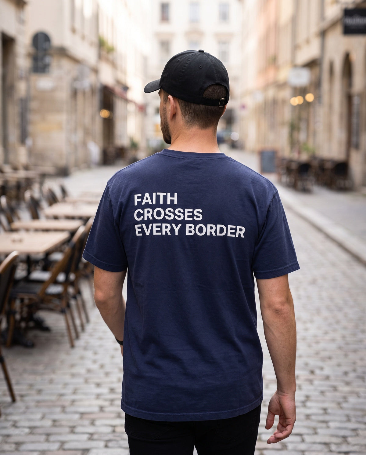 Back of a truenavy Faith Crosses Every Border Christian t-shirt showing the large back print