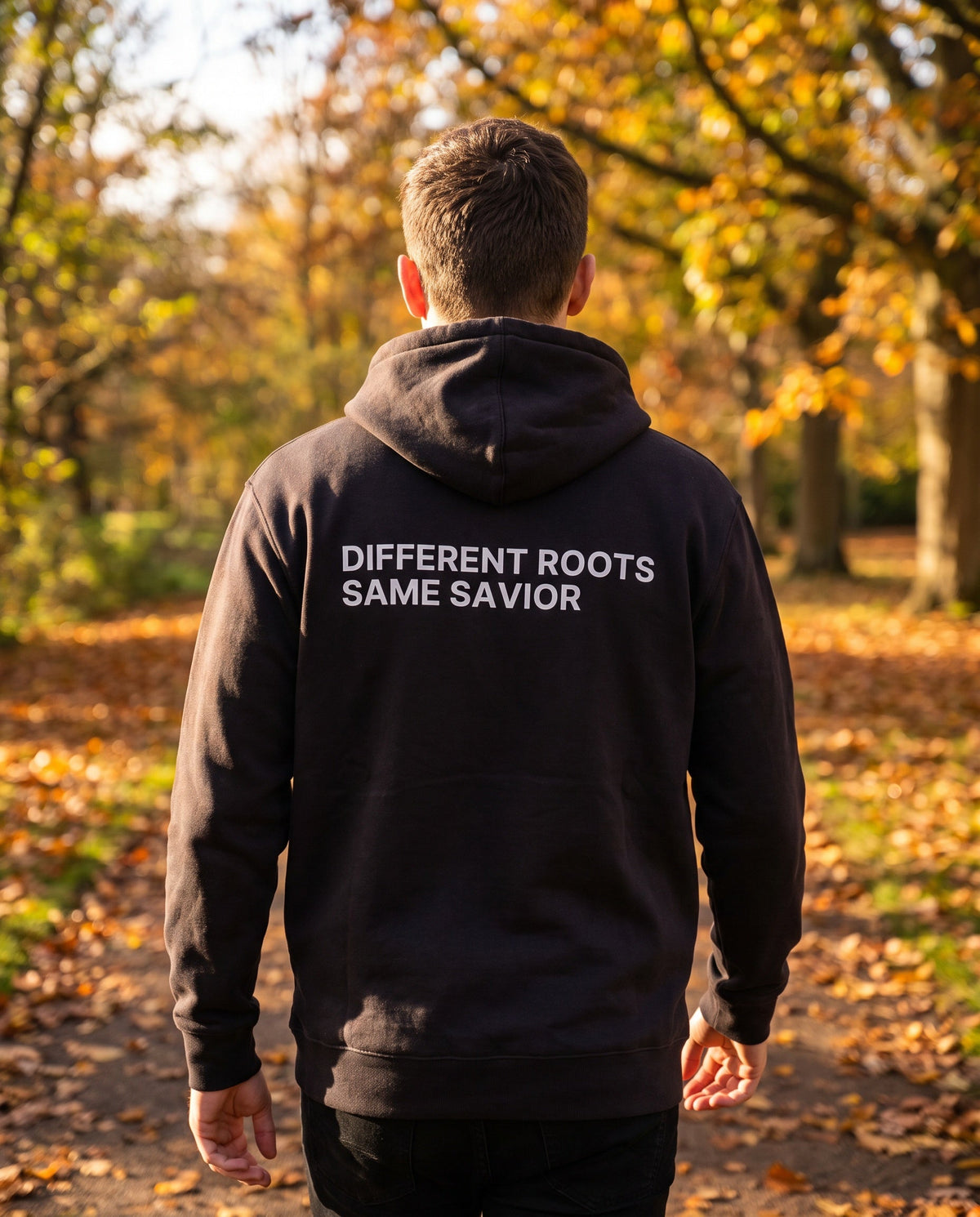 Back of a black Different Roots. Same Savior Christian hoodie showing the large back print