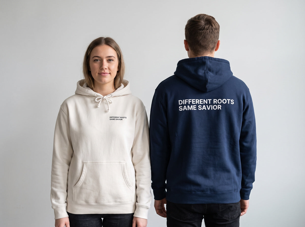 Couple wearing Different Roots. Same Savior Christian hoodies, front chest print and large back print