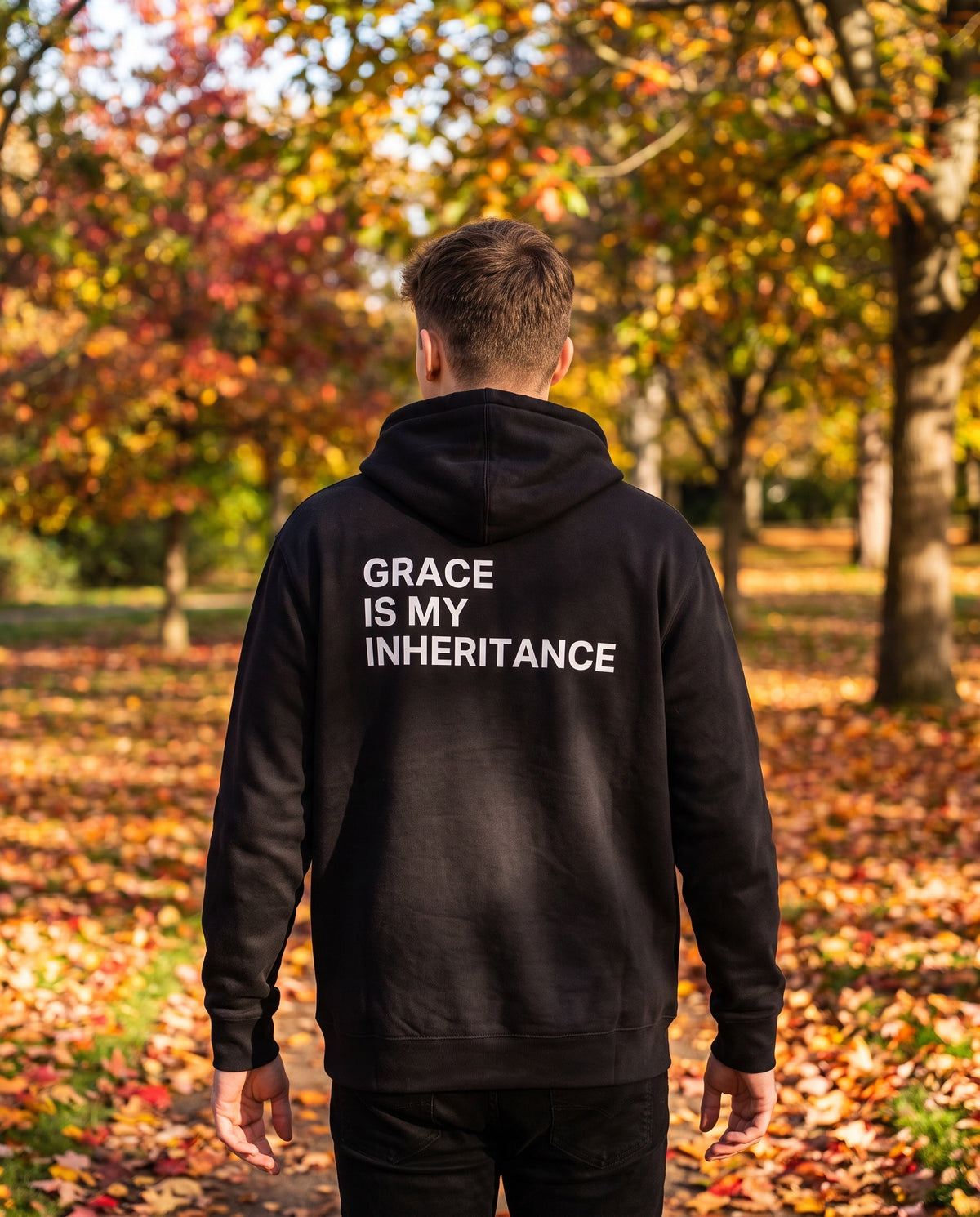 Back of a black Grace Is My Inheritance Christian hoodie showing the large back print