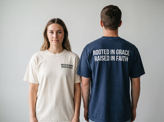 Couple wearing Rooted in Grace. Raised in Faith Christian t-shirts, front chest print and large back print