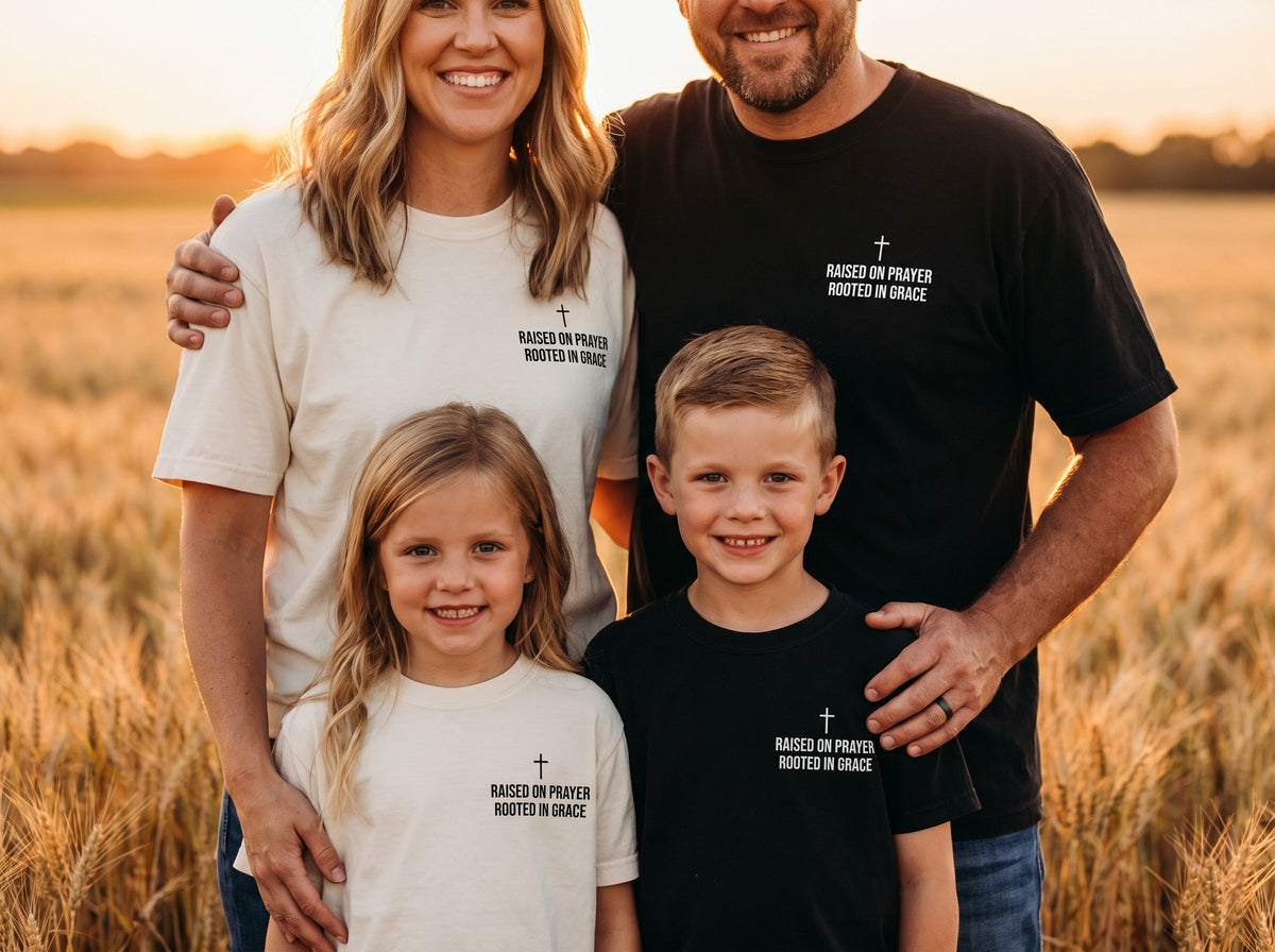 Family wearing matching Raised on Prayer. Rooted in Grace Cross Edition Christian t-shirts