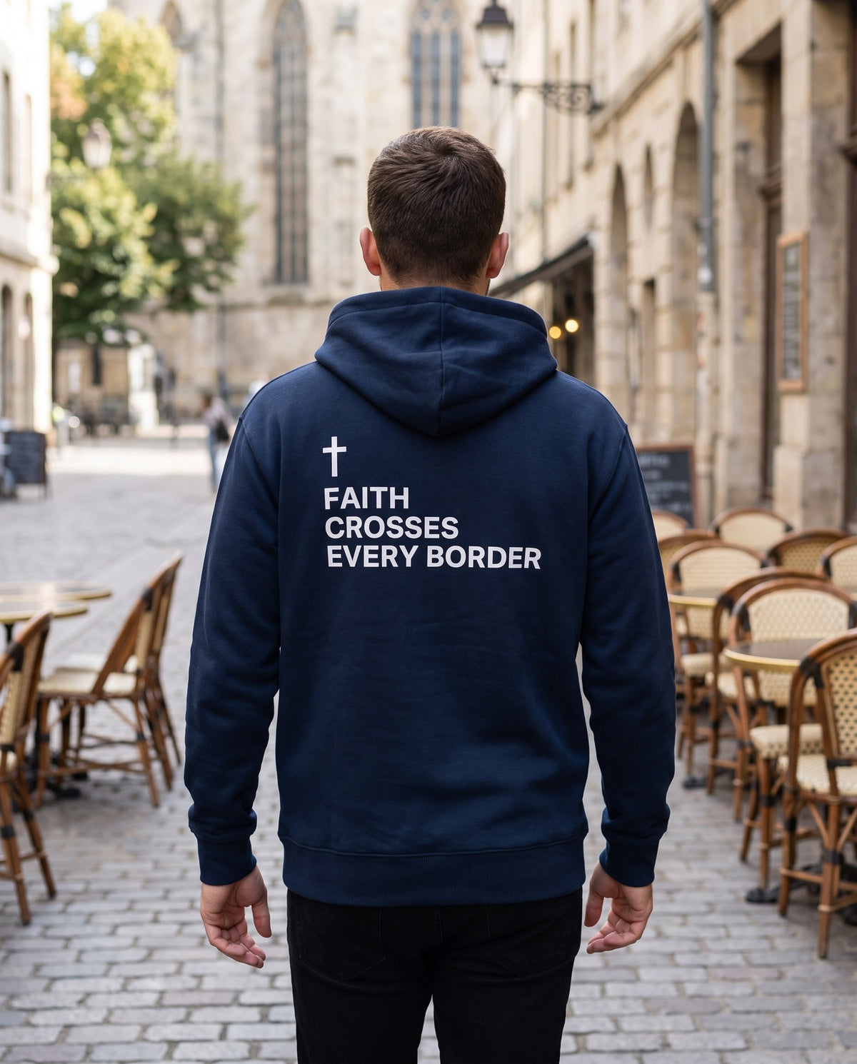 Back of a navy Faith Crosses Every Border Cross Edition Christian hoodie showing the large back print