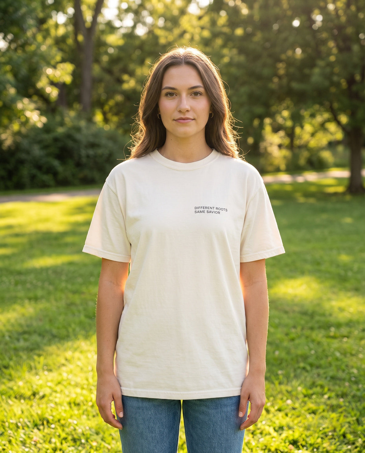 Woman wearing a ivory Different Roots. Same Savior Christian t-shirt, chest print