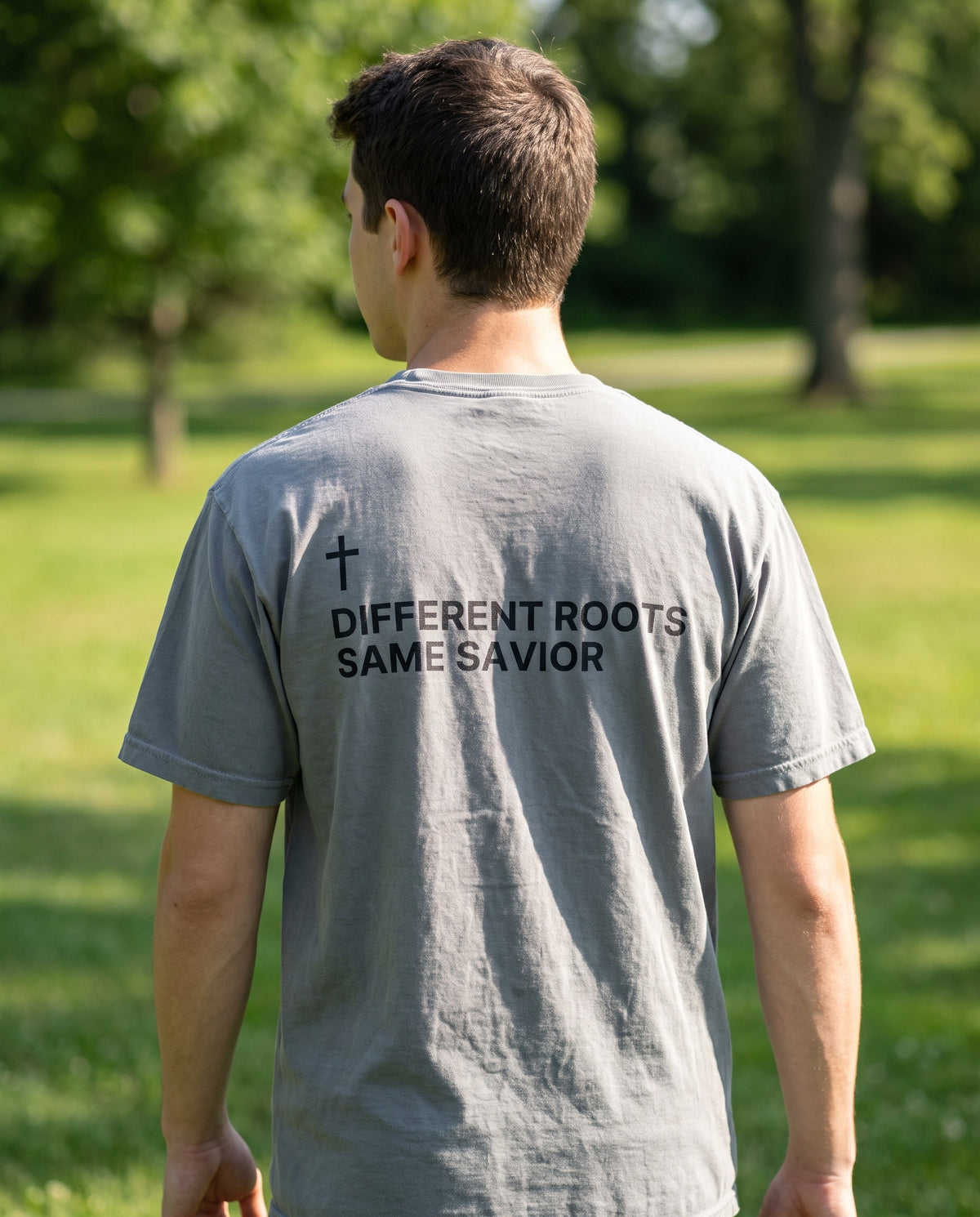 Back of a grey Different Roots. Same Savior Cross Edition Christian t-shirt showing the large back print