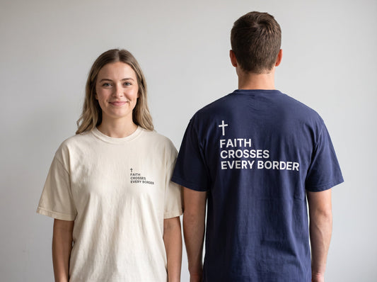 Couple wearing Faith Crosses Every Border Cross Edition Christian t-shirts, front chest print and large back print