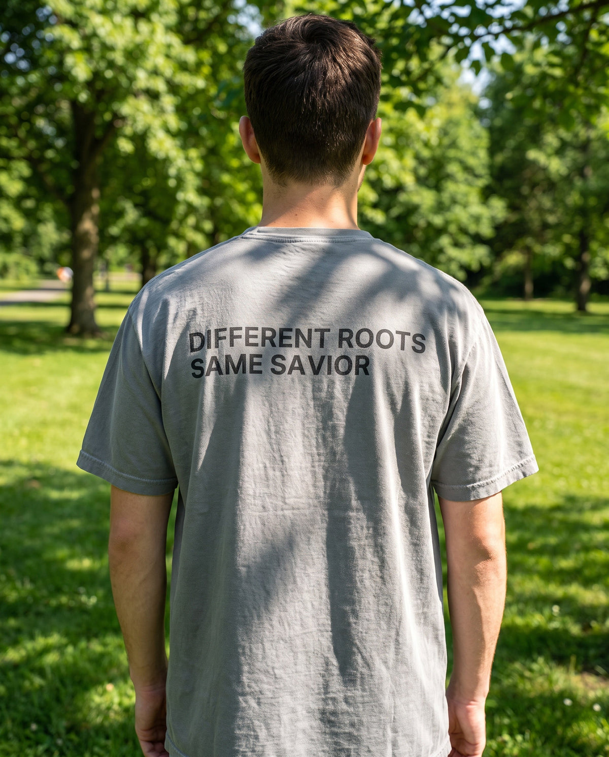 Back of a grey Different Roots. Same Savior Christian t-shirt showing the large back print