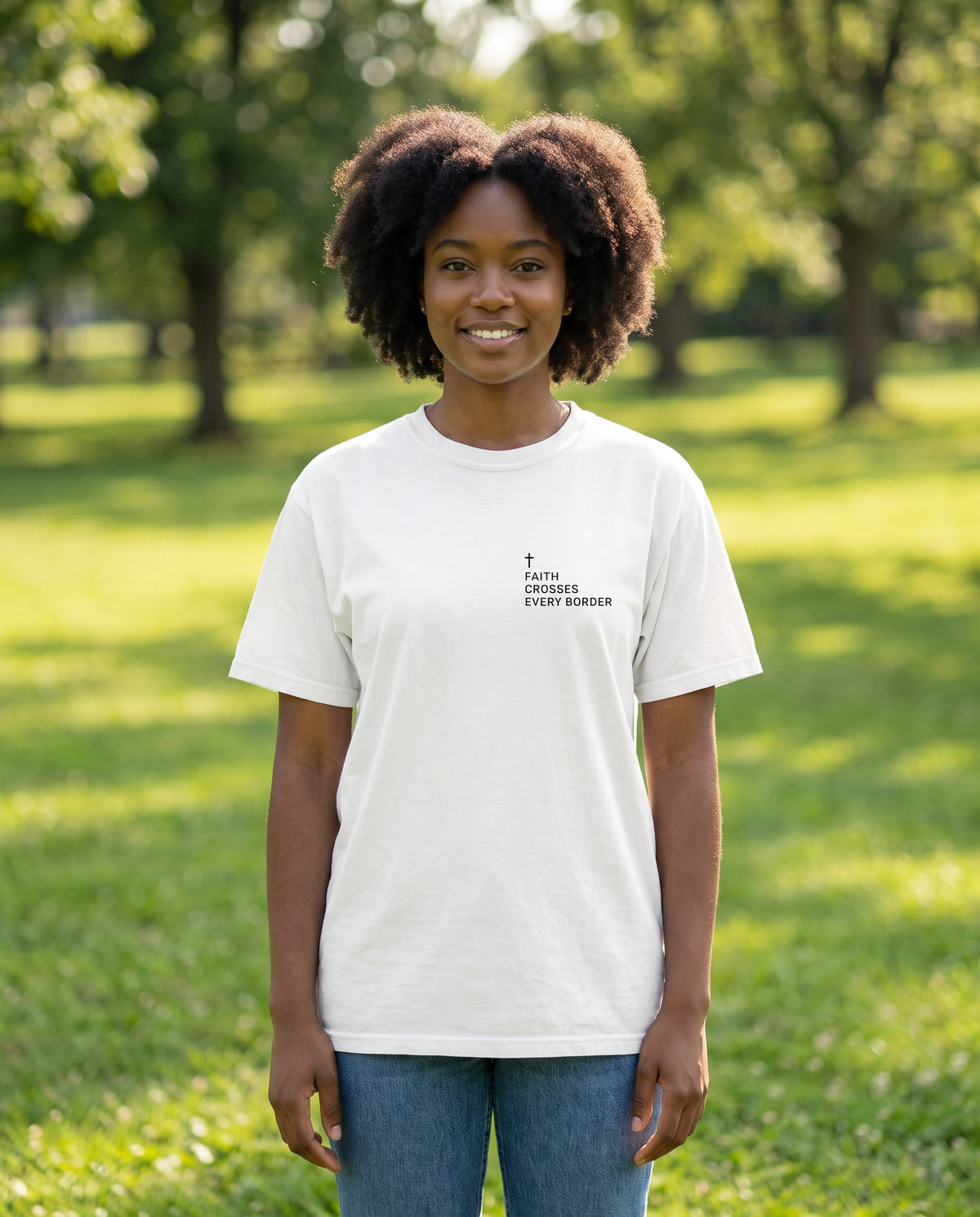 Woman wearing a white Faith Crosses Every Border Cross Edition Christian t-shirt with cross chest print