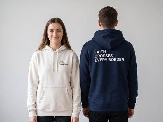 Couple wearing Faith Crosses Every Border Christian hoodies, front chest print and large back print