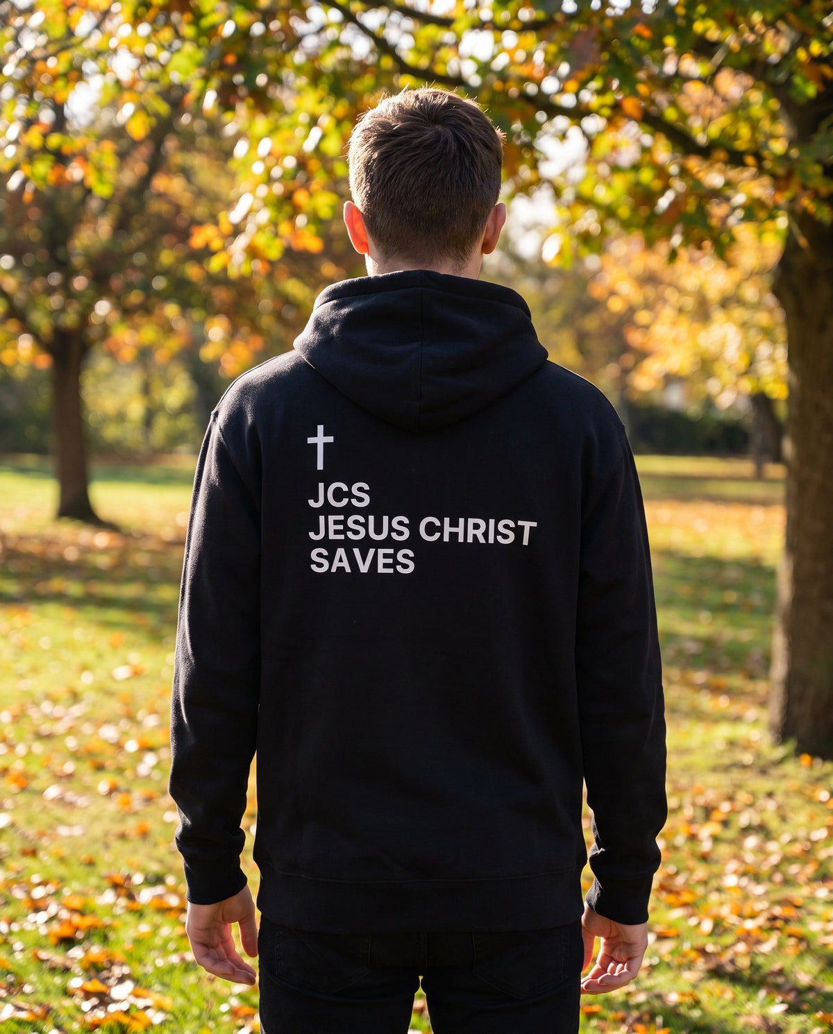 Back of a black JCS — Jesus Christ Saves Cross Edition Christian hoodie showing the large back print