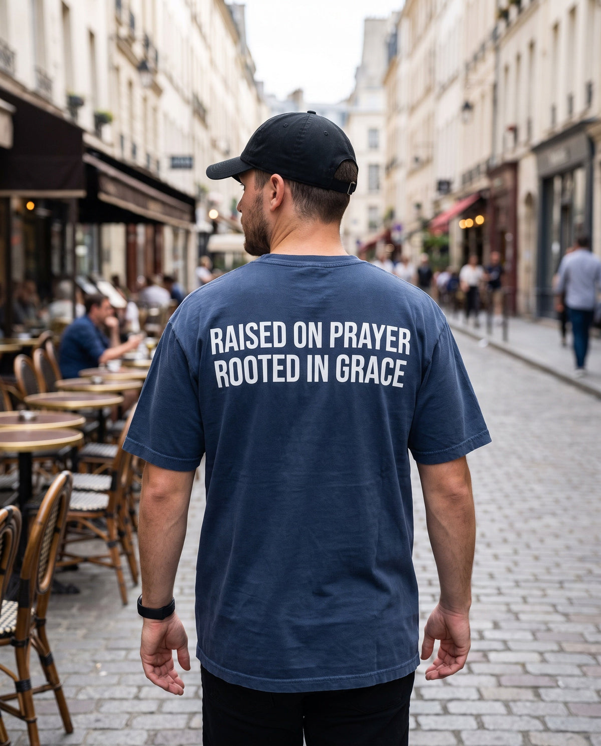 Back of a truenavy Raised on Prayer. Rooted in Grace Christian t-shirt showing the large back print